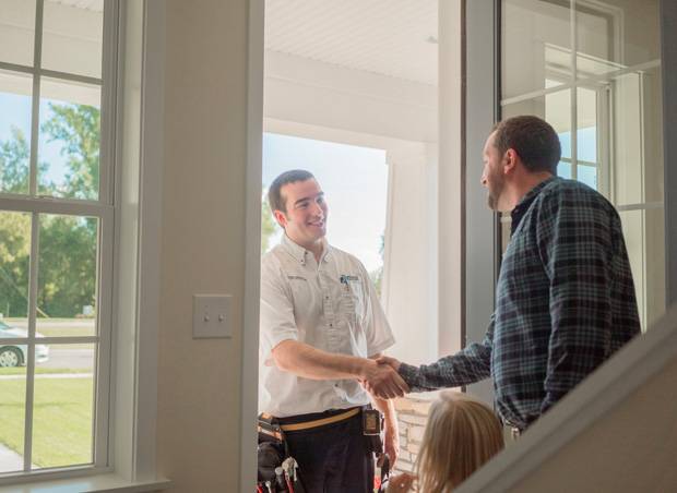 Technician and Customer Shaking Hands